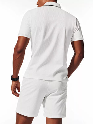 Men's white waffle knit polo shirt and jogger shorts set.