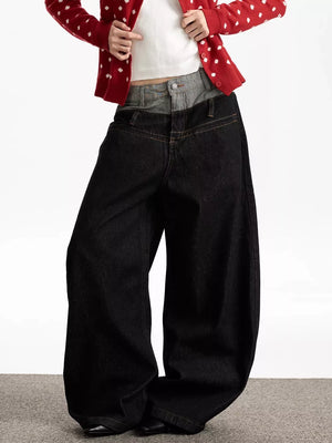 Layered double waist wide leg jeans in dark wash cotton with contrast grey denim overlay.