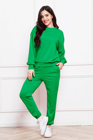 Green relaxed fit sweat set with crew neck sweatshirt and jogger pants.