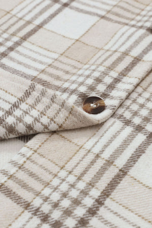 Oversized plaid shacket with attached hoodie in beige and white plaid, featuring a button detail.