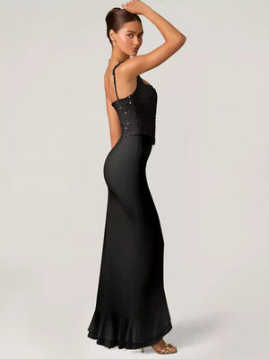 Black sequin ruffle maxi gown with spaghetti straps and a mermaid skirt.
