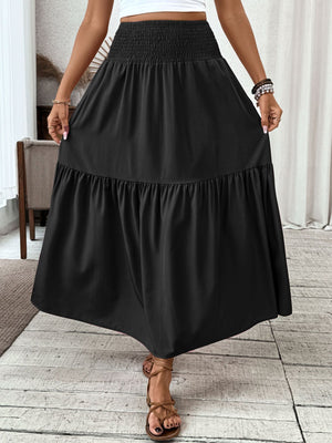Black ruffled smocked waist maxi skirt with a tiered hem