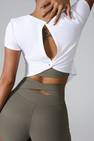 White active tee with short sleeves and a twisted back detail.