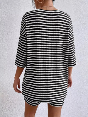 Chic striped two-piece set in black stripes with elbow sleeves and shorts.