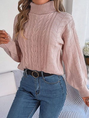 Dusty Pink cable knit turtleneck sweater with drop shoulder and open knit details.
