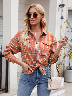 Orange plaid overshirt with patch pockets, buttoned cuffs and a knotted front.