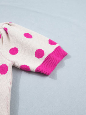 Cream polka dot knit top with hot pink dots and ribbed cuffs.