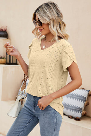 Light yellow knit top with perforated sleeve detail and V-neck.