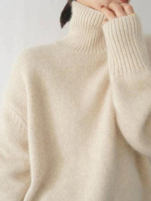 Cream cashmere turtleneck sweater with ribbed collar and cuffs