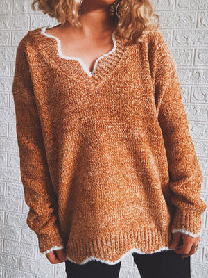 Scalloped trim V-neck acrylic sweater in Red Orange with white trim.