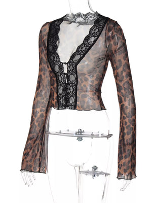 Sheer leopard print t-shirt with black lace trim and long sleeves.