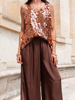 Sequin embellished tank top in a rose gold hue with a scoop neckline.