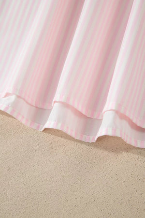 Pink and white striped polyester blouse with ruffled hem detail