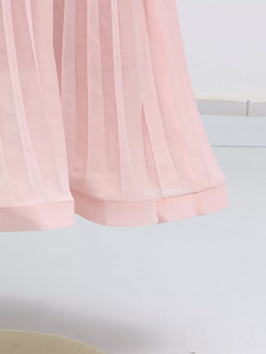 Pink pleated skirt suit with side slit detail and banded hem