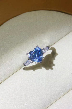 Blue heart sapphire platinum trilogy ring with baguette side stones