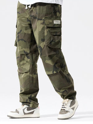 Casual cargo pants in camouflage pattern with drawstring waist and multiple pockets.