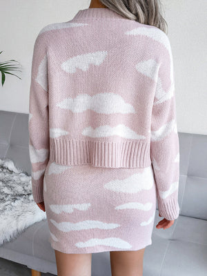 Dusty pink acrylic knit co-ord set with white cloud pattern, crew neck sweater and mini skirt.