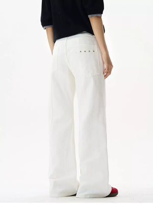 White wide-leg sweatpants with silver stud detail on back pockets.