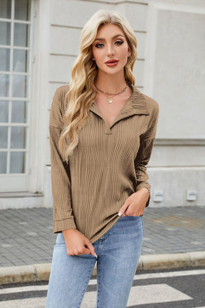 Taupe pleated wave-effect collared long sleeve blouse with a V-neck.