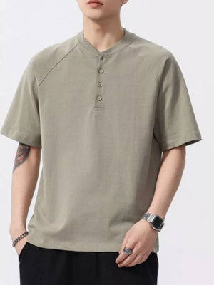 Men's green buttoned henley t-shirt with short sleeves and a band collar.