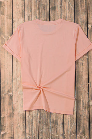 Watermelon pink t-shirt with rolled sleeves and a twisted hem detail.