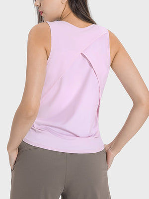 Lilac performance tank top with a cross-back detail and sleeveless design.