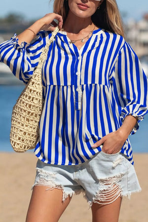 Blue and white striped button-down shirt with balloon sleeves and a tiered hem.