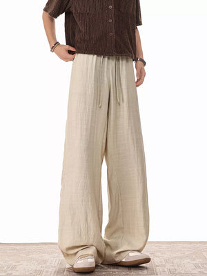 Khaki relaxed fit drawstring sweatpants with wide legs and a comfortable casual style.