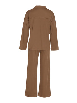 Brown ribbed knit lounge set with relaxed fit long sleeve top and wide leg pants.