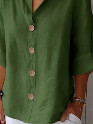 Dark green button-down shirt with relaxed fit and wooden buttons.