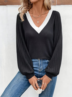 Black ribbed sleeve top with white V-neck contrast collar and balloon sleeves.