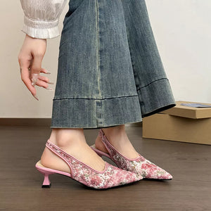 Pink floral lace slingback kitten heels with pointed toe and kitten heel.