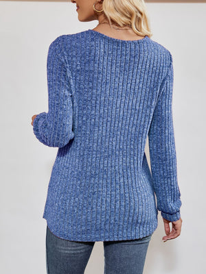 Cobalt blue textured ribbed V-neck pullover sweater with long sleeves.