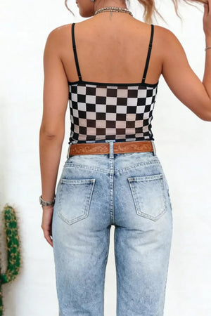 Sheer checkered cami with spaghetti straps and a square neckline, made of polyester.