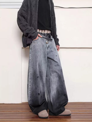 Men's washed wide leg jeans in grey with distressed details and a baggy fit.