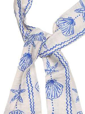 White maternity cover-up romper with blue seashell print and crisscross detail