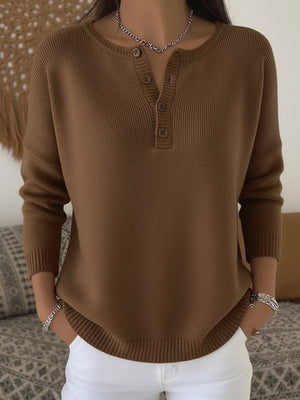 Brown long-sleeve knit top with button detail at the neckline.