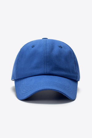 Cobalt blue cotton baseball cap with stitched details and curved brim.