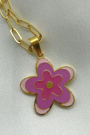 Enamel floral pendant necklace in pink and purple hues on a gold-plated chain.