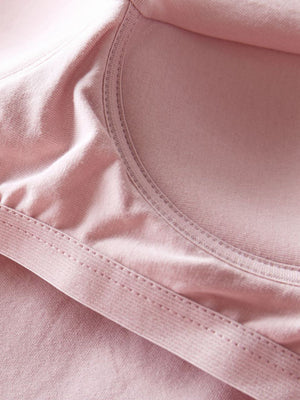 Pale Blush built-in support tank top detail showing seams and soft fabric.
