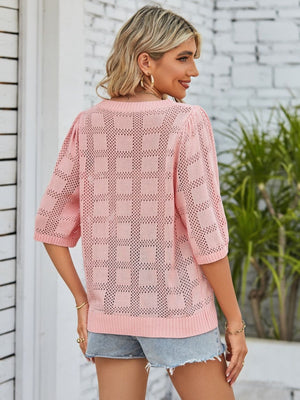 Openwork box stitch knit top in blush pink with puff sleeves and crew neck.