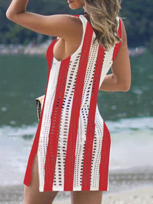 Multicolor openwork knit swim dress with side slits and tassel trim.