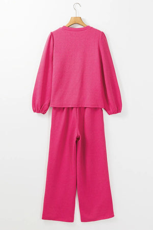 Textured puff sleeve lounge set in hot pink with a geometric pattern.