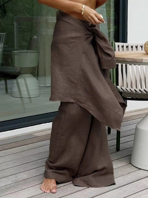 Brown relaxed fit two-piece set with wide-leg pants and a knotted button-up top.