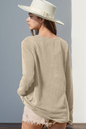 Waffle knit henley shirt in tan with long sleeves and a relaxed fit.