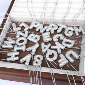 Pave initial pendant necklaces with beaded chains in silver tone, featuring various alphabet letters.