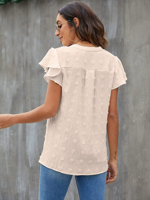 Textured voile blouse in white with flutter sleeves and a dotted pattern.