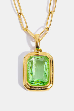 18K gold necklace with a rectangular light green gemstone pendant.