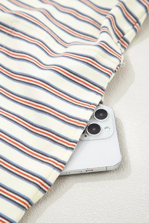 Casual striped mini dress in cotton with side pockets, showing a phone tucked in.
