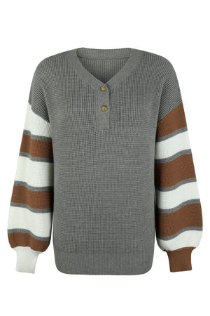 Waffle knit henley sweater in dark gray with striped balloon sleeves in brown and white.